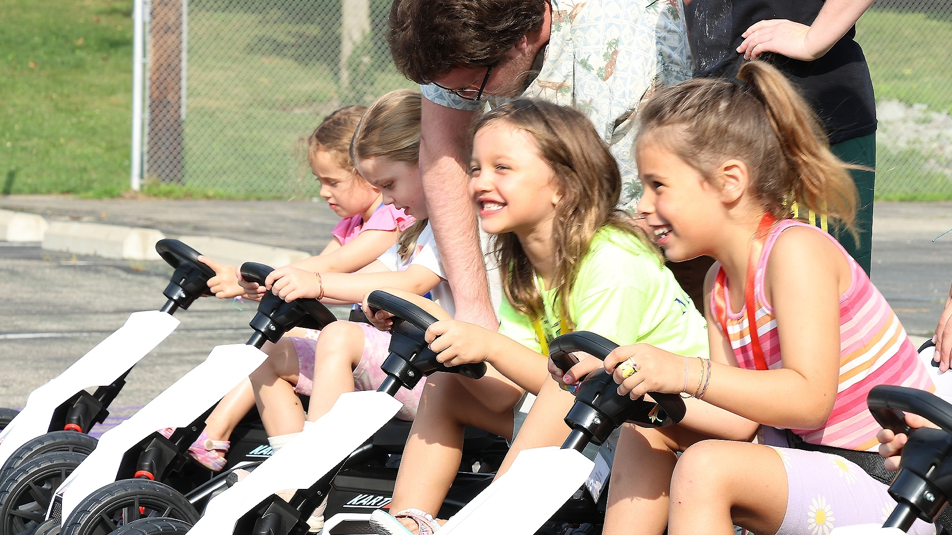 children on pedal cars